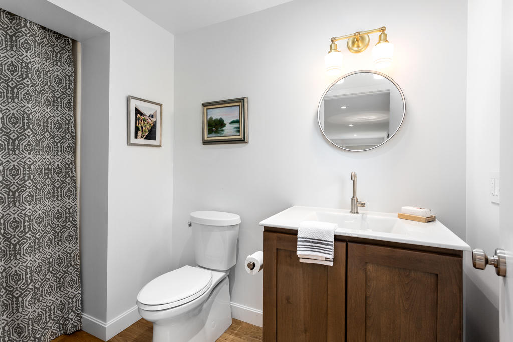 33 Point Road Norwalk, CT 06854 - Photo 15 of 29 a bathroom with a sink a toilet and a mirror