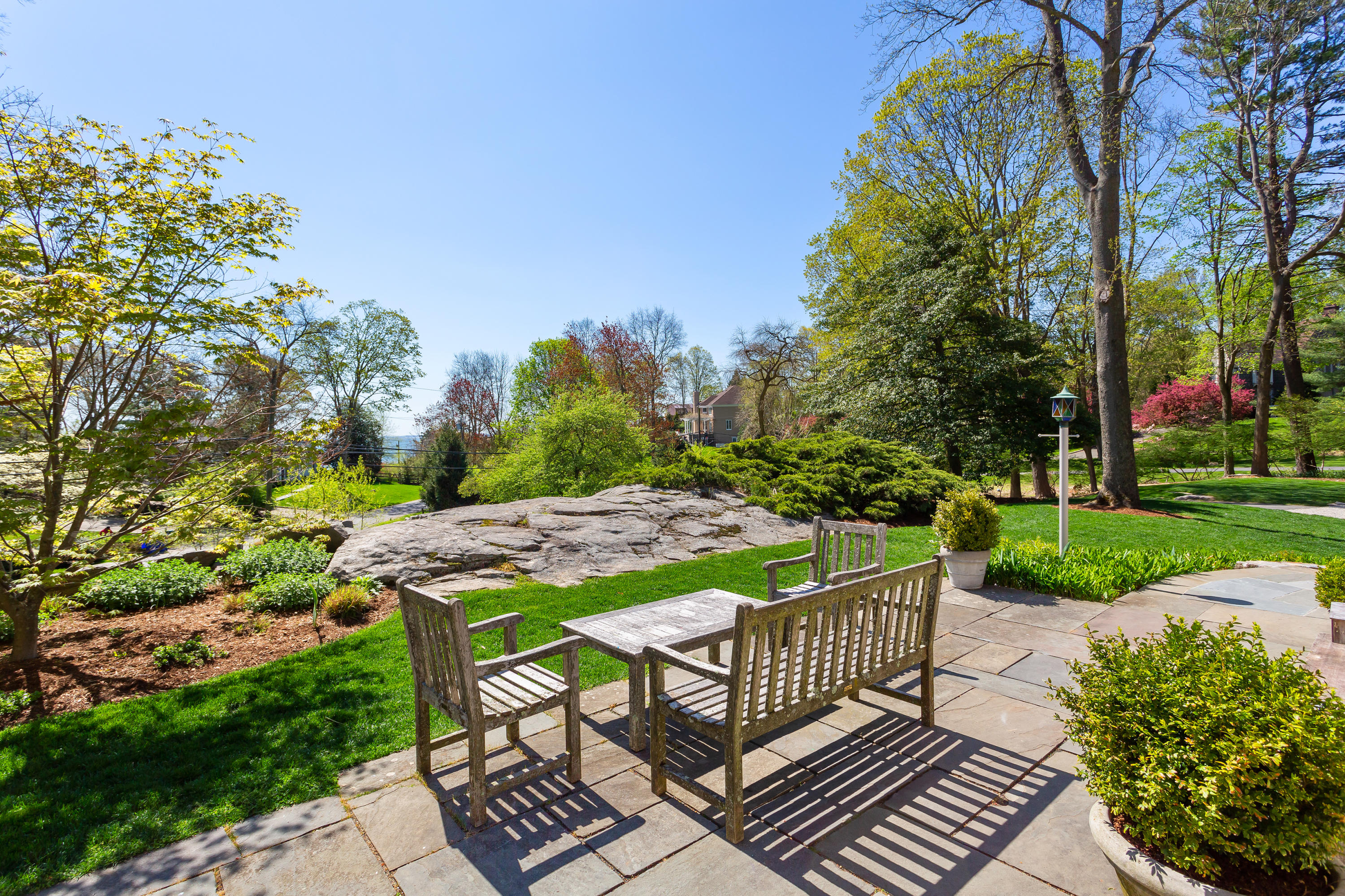 33 Point Road Norwalk, CT 06854 - Photo 23 of 29 a patio with table and chairs and potted plants