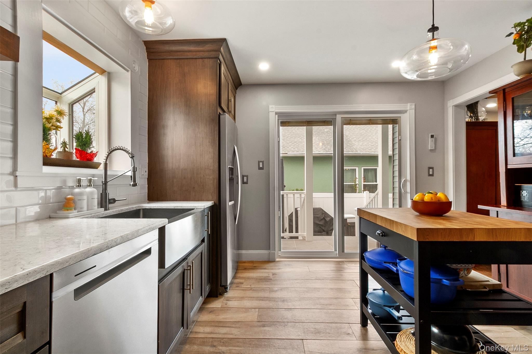189 Rombout Avenue Beacon, NY 12508 - Photo 11 of 35 a kitchen with stainless steel appliances granite countertop a sink a stove and a refrigerator