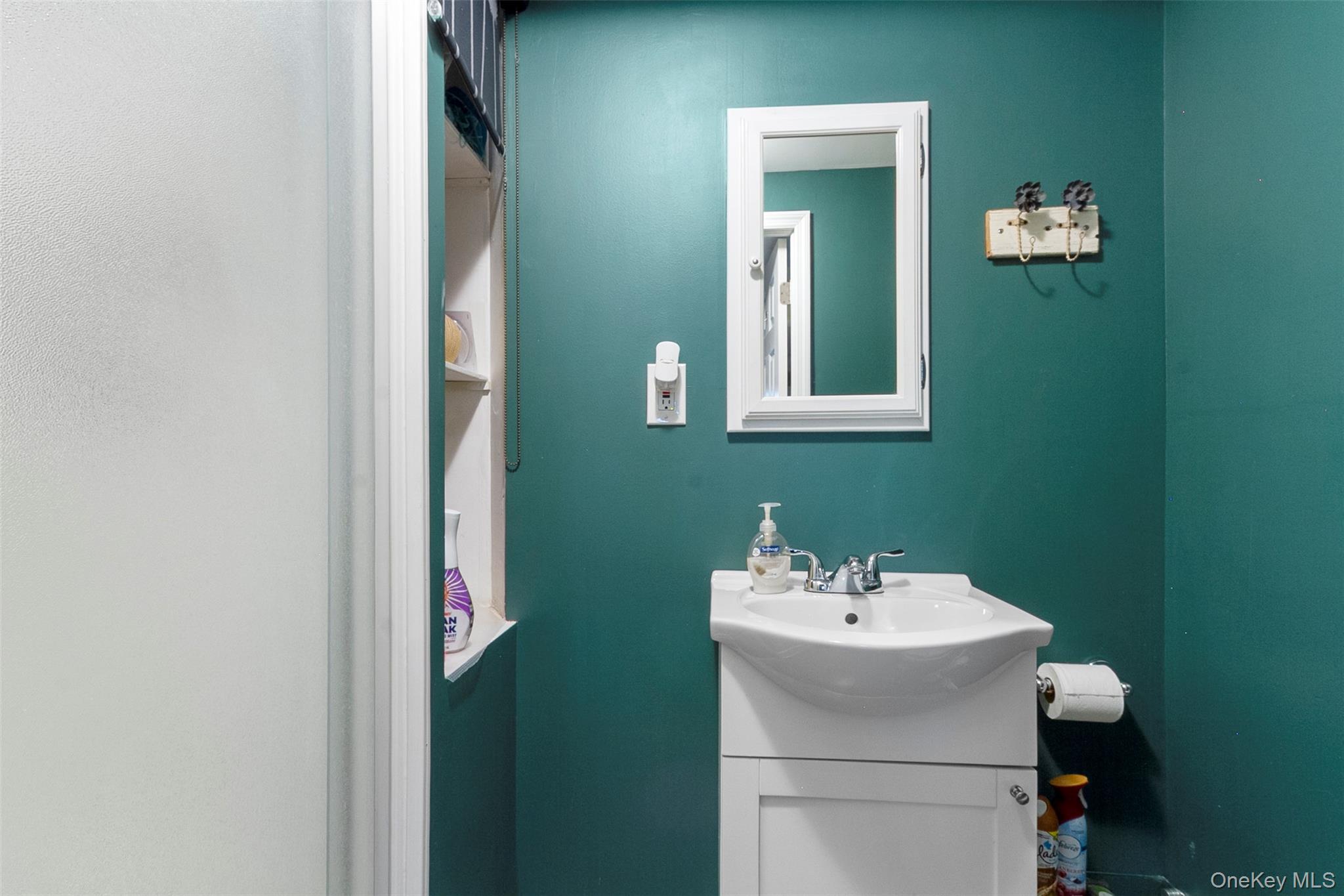 189 Rombout Avenue Beacon, NY 12508 - Photo 25 of 35 a bathroom with a sink and a mirror