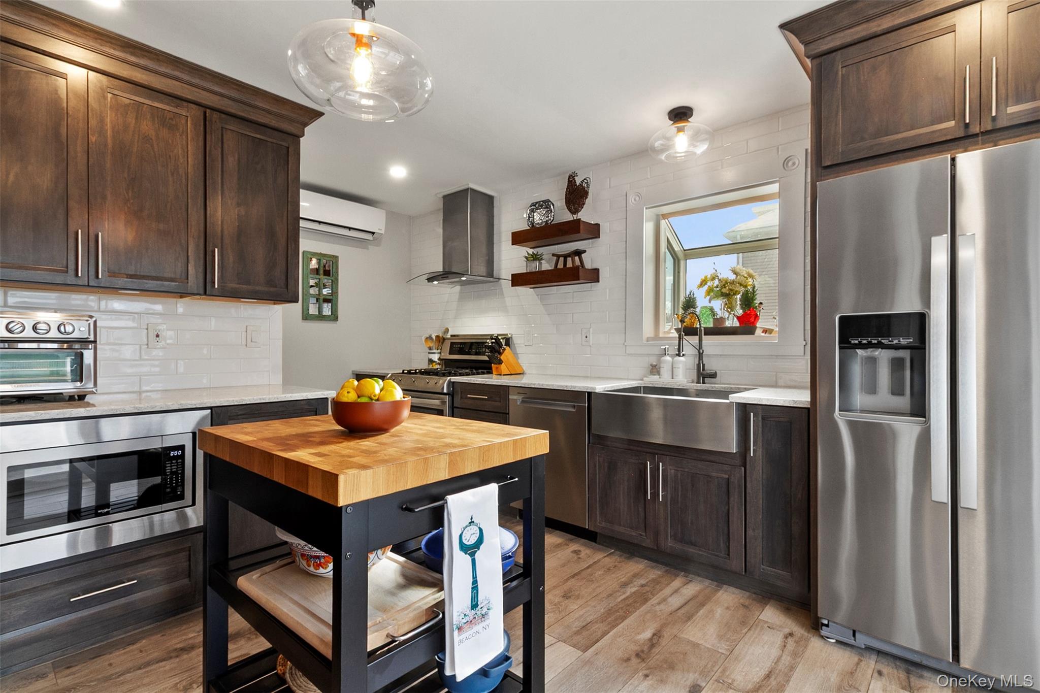 189 Rombout Avenue Beacon, NY 12508 - Photo 9 of 35 a kitchen with stainless steel appliances a sink a stove a refrigerator and cabinets