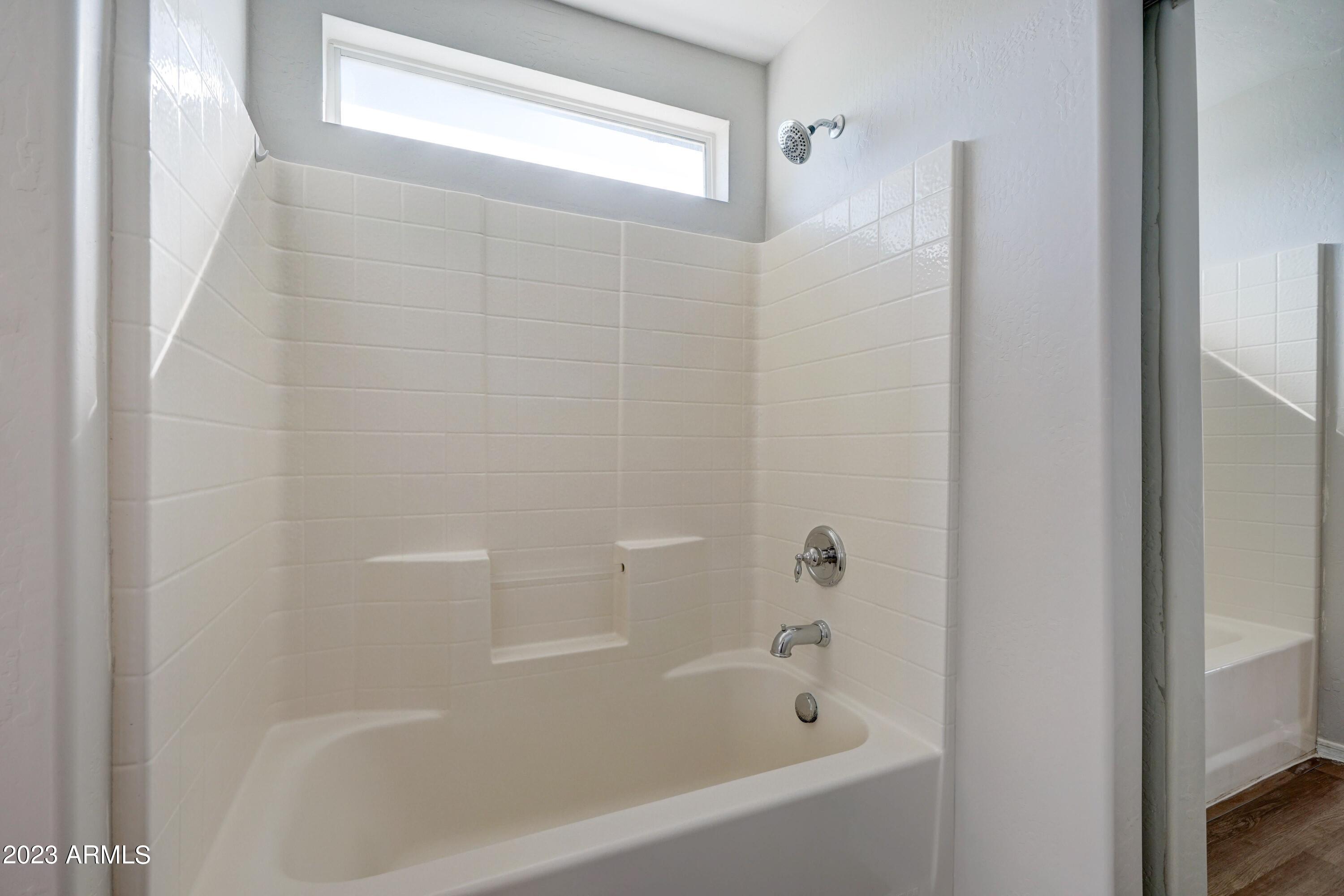 3813 West Shumway Farm Road Phoenix, AZ 85041 - Photo 18 of 31 3813 Primary bath shower combo