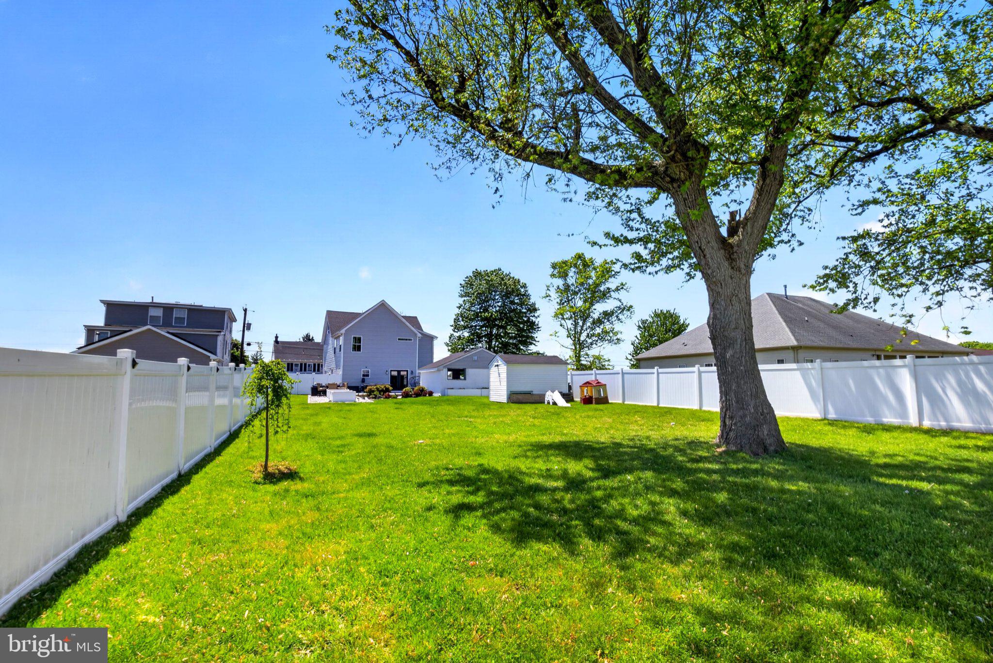 25015 Mt Pleasant Road Columbus, NJ 08022 - Photo 45 of 59 Spacious yard under a clear blue sky.