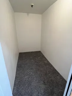 an empty room with a bench