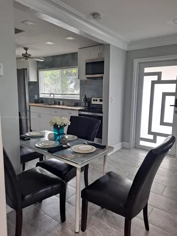 a view of a dining room with furniture