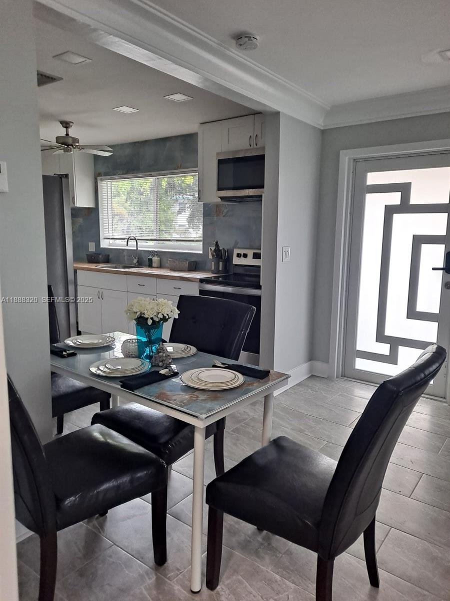 a view of a dining room with furniture
