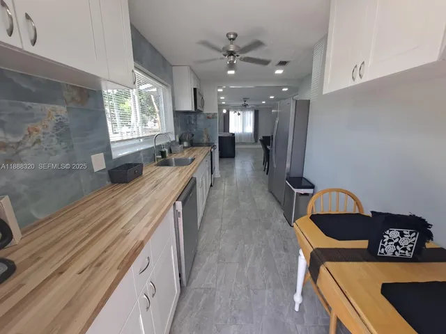 a living room with furniture and window