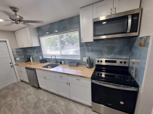 a kitchen with a stove and a microwave