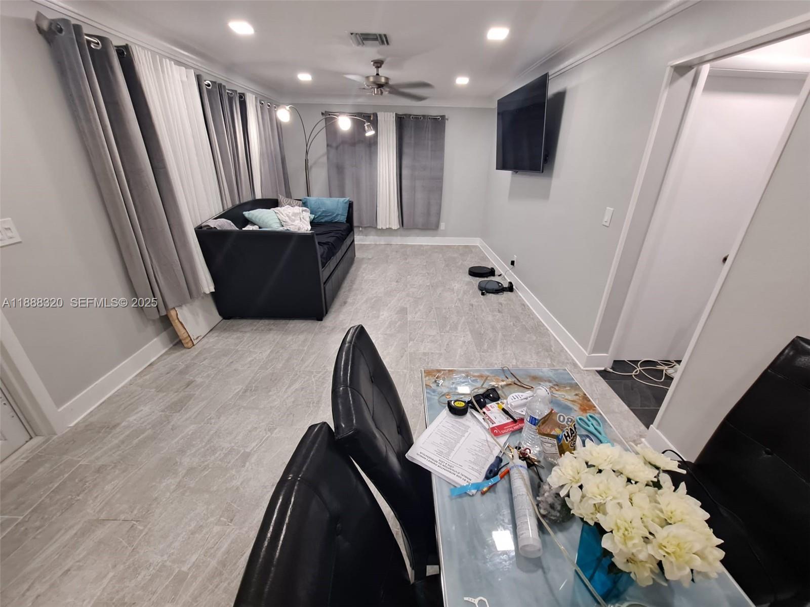 2242 Polk Street, Unit 1 Hollywood, FL 33020 - Photo 26 of 31 a very nice looking room with a mirror