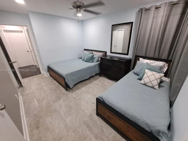 a living room with furniture and a mirror