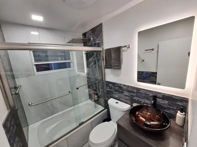 a bathroom with a toilet and a sink