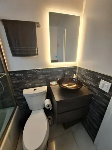 a bathroom with a sink and a toilet