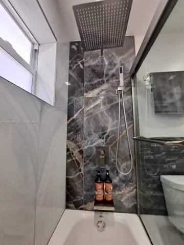 a bathroom with a sink and a shower