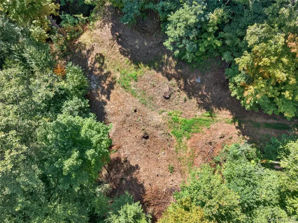 a backyard of a house with a yard with outdoor seating