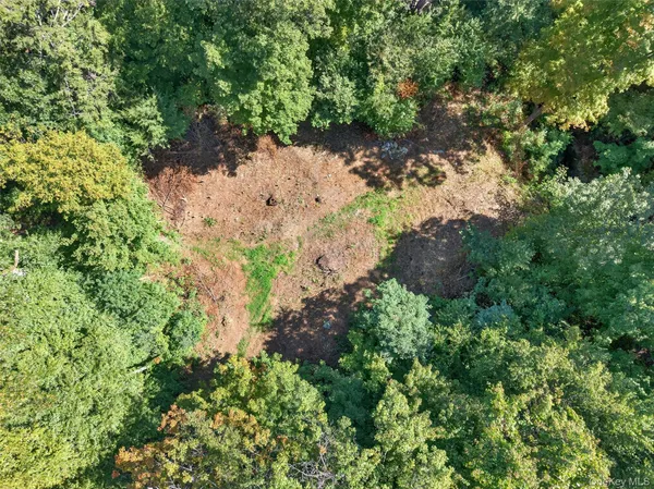 an aerial view of houses with yard