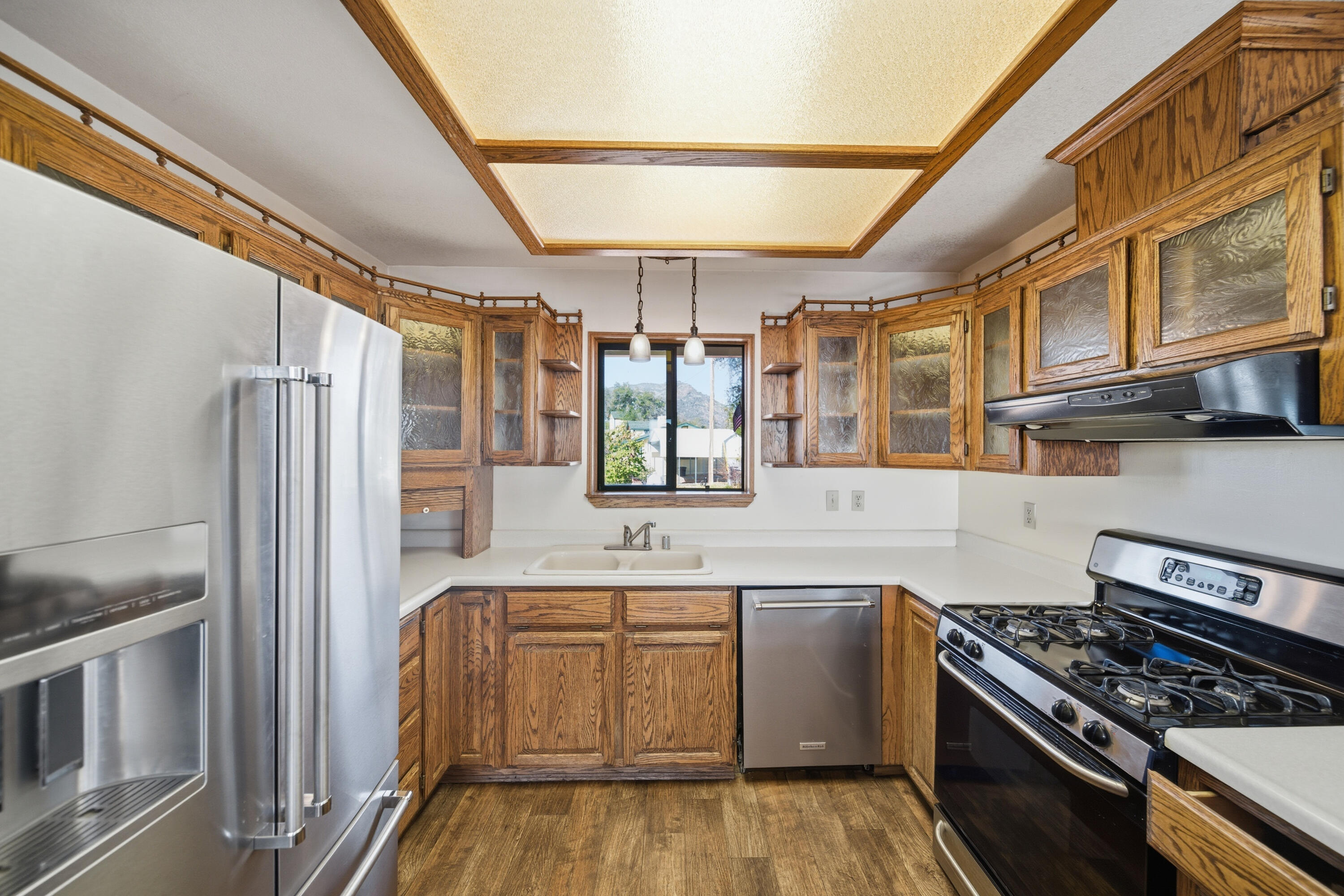 14018 Highview Trail Redding, CA 96003 - Photo 11 of 41 a kitchen with stainless steel appliances granite countertop a refrigerator and a stove