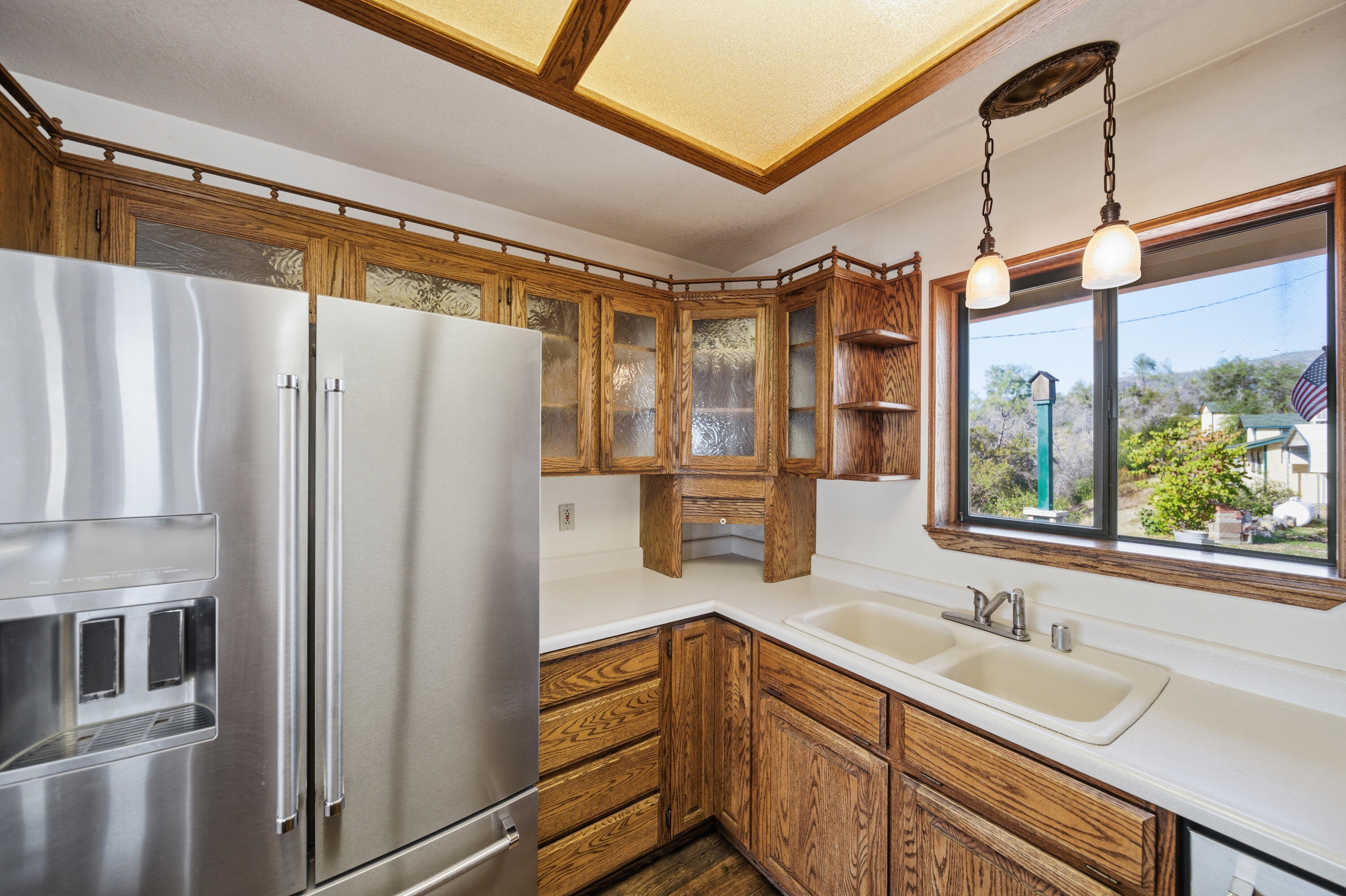 14018 Highview Trail Redding, CA 96003 - Photo 12 of 41 a kitchen with a refrigerator and countertop sink