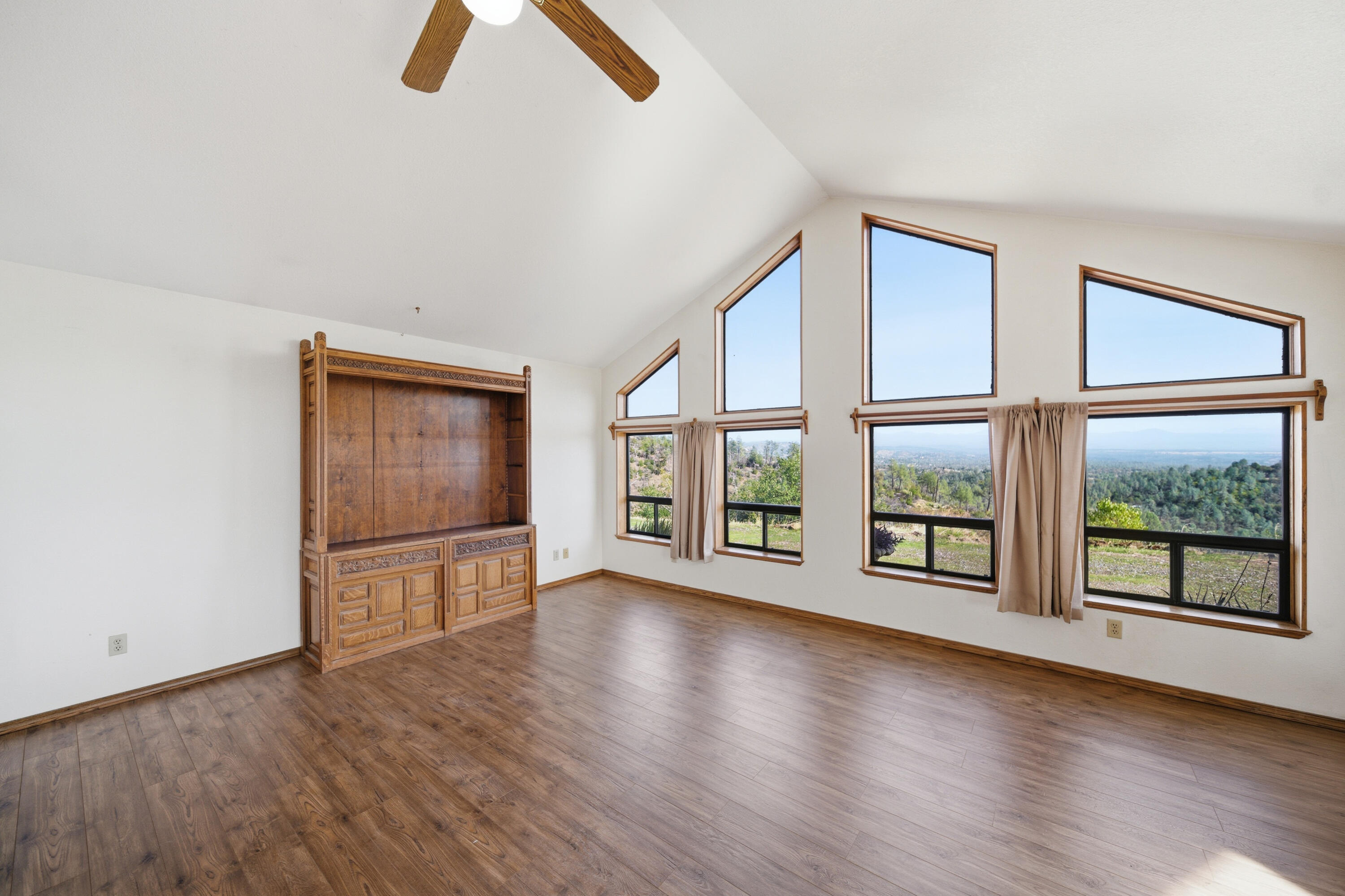 14018 Highview Trail Redding, CA 96003 - Photo 14 of 41 an empty room with chandelier fan and windows