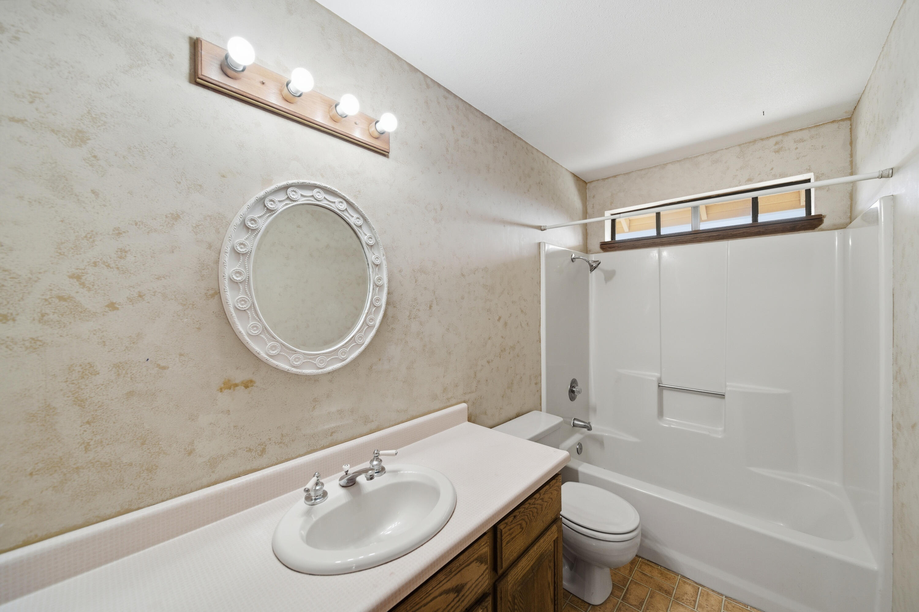 14018 Highview Trail Redding, CA 96003 - Photo 23 of 41 a bathroom with a toilet a sink and a mirror