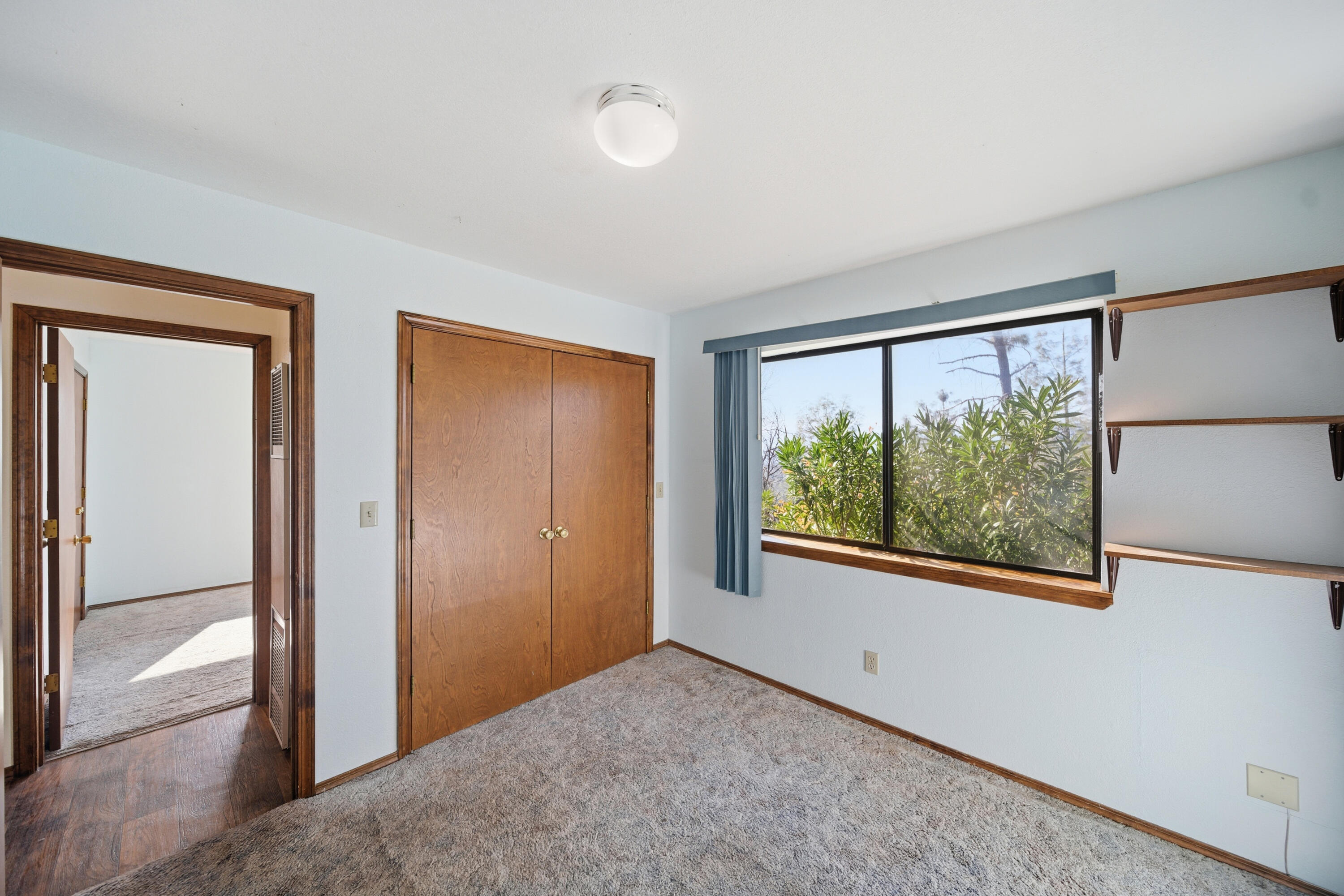 14018 Highview Trail Redding, CA 96003 - Photo 24 of 41 a view of an empty room with a window