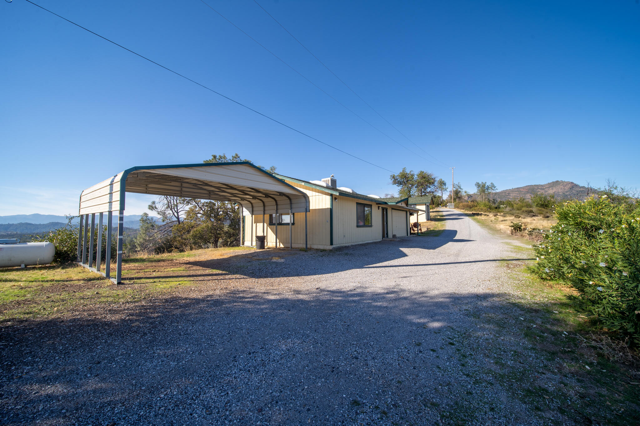 14018 Highview Trail Redding, CA 96003 - Photo 5 of 41 a view of a street with a building in the background