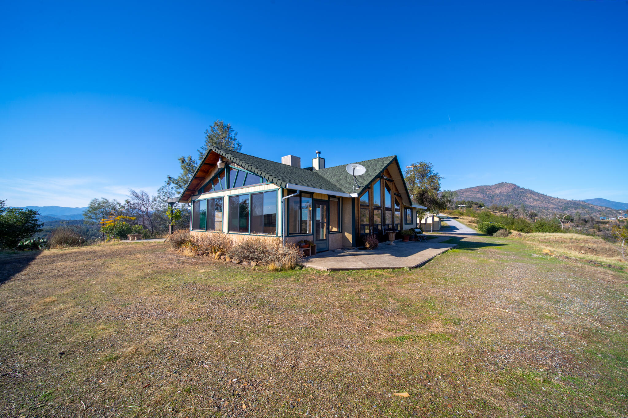 14018 Highview Trail Redding, CA 96003 - Photo 9 of 41 a view of house with outdoor space and sitting area