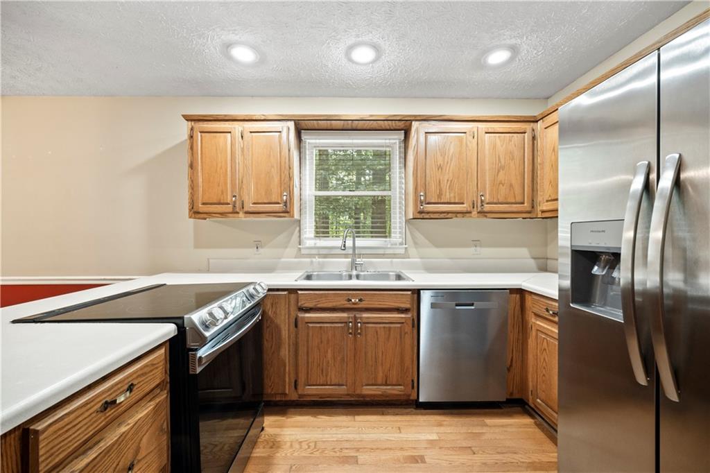 2009 Ben Higgins Road Dahlonega, GA 30533 - Photo 6 of 25 a kitchen with a sink stove and cabinets