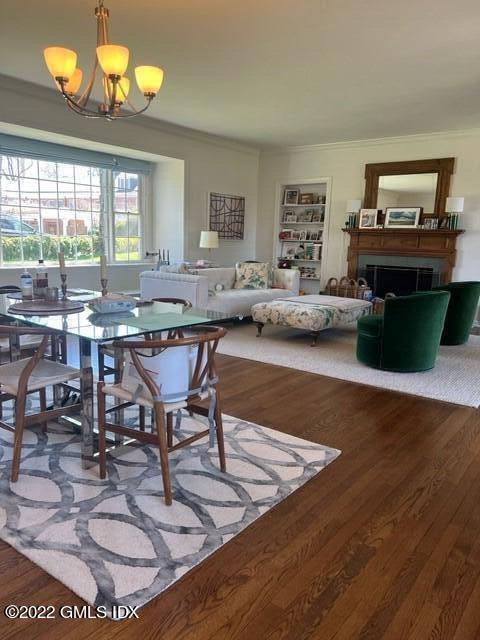 30 Field Point Drive, Unit GUEST HOUSE Greenwich, CT 06830 - Photo 3 of 11 a view of a livingroom with furniture window and wooden floor