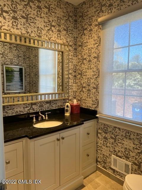 30 Field Point Drive, Unit GUEST HOUSE Greenwich, CT 06830 - Photo 4 of 11 a bathroom with a sink and a mirror