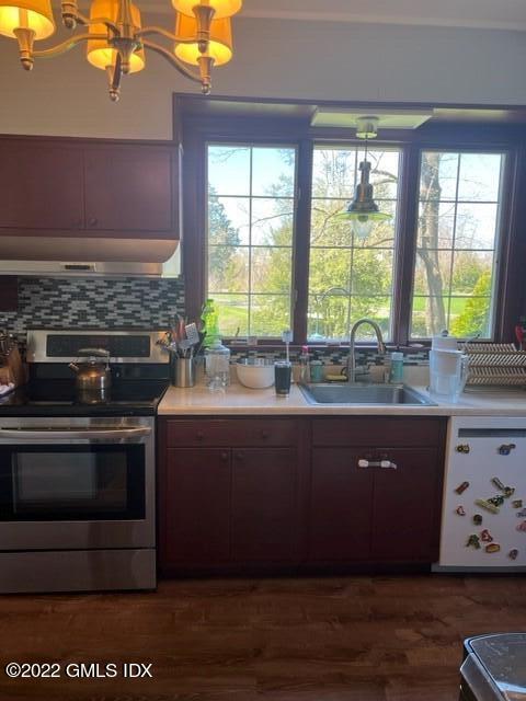 30 Field Point Drive, Unit GUEST HOUSE Greenwich, CT 06830 - Photo 6 of 11 a kitchen with a sink wooden floor and a large window