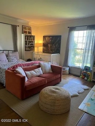 a bathroom with a toilet a sink and a mirror