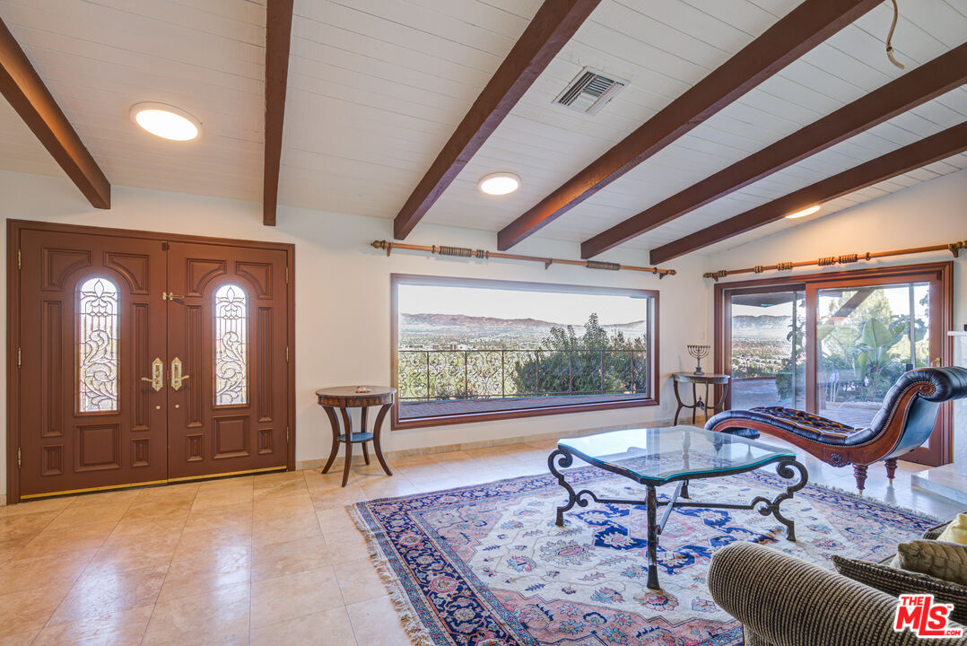 4520 Gable Drive Encino, CA 91316 - Photo 29 of 58 a living room with furniture and a large window