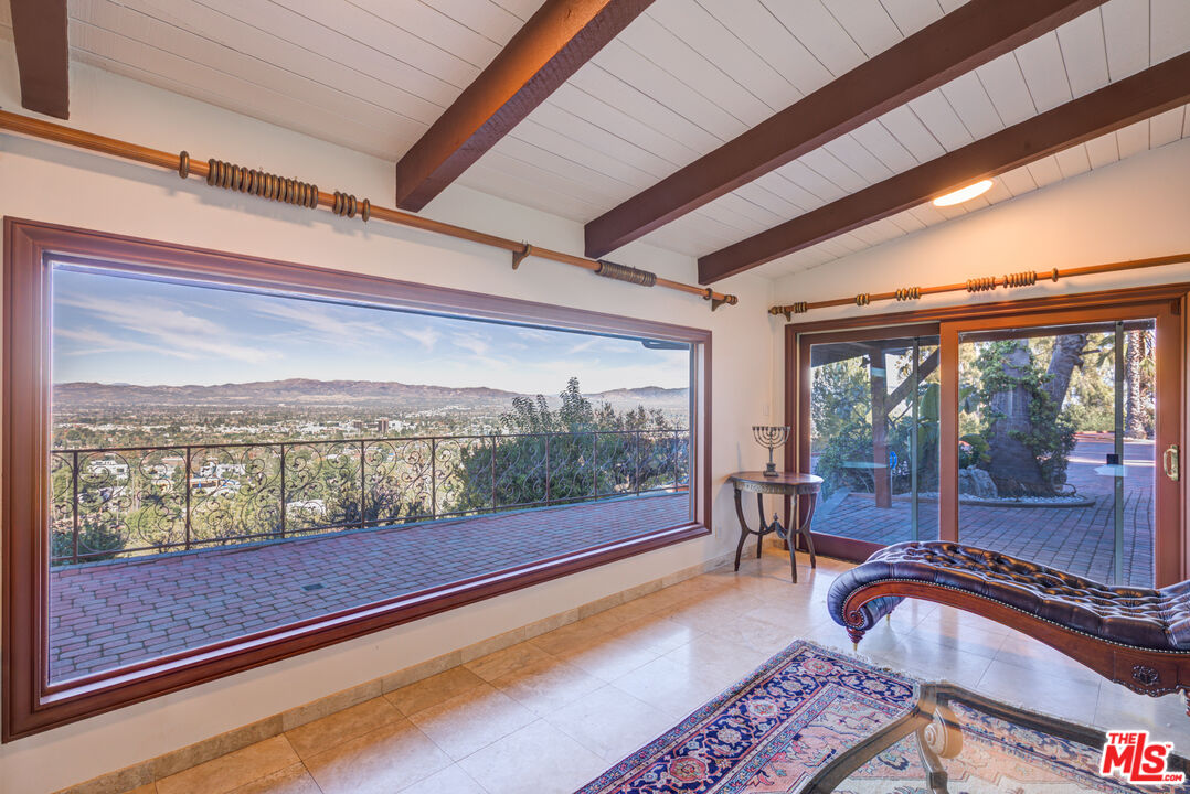 4520 Gable Drive Encino, CA 91316 - Photo 30 of 58 a room with filled with furniture and large windows