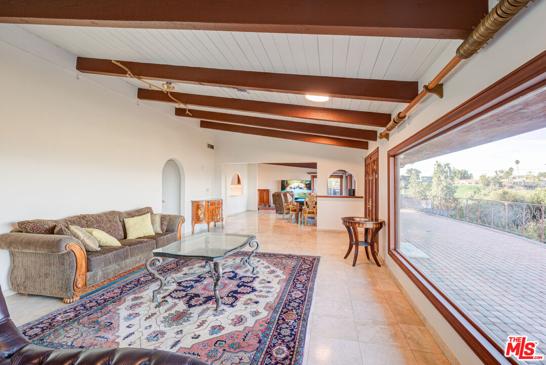 4520 Gable Drive Encino, CA 91316 - Photo 31 of 58 a living room with furniture and a table