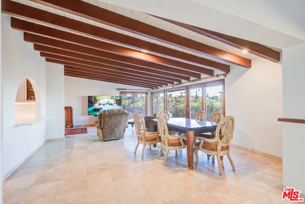 a kitchen with kitchen island a counter space a sink and stainless steel appliances