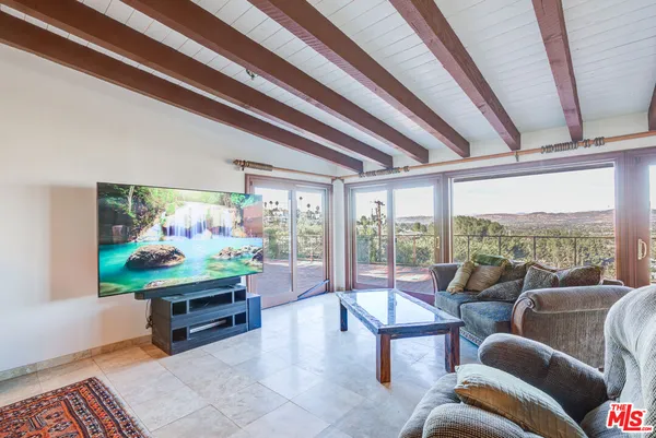 a kitchen with a sink a window and cabinets