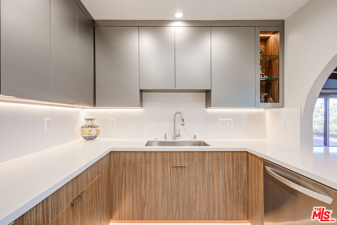 4520 Gable Drive Encino, CA 91316 - Photo 43 of 58 a kitchen with a sink a window and cabinets