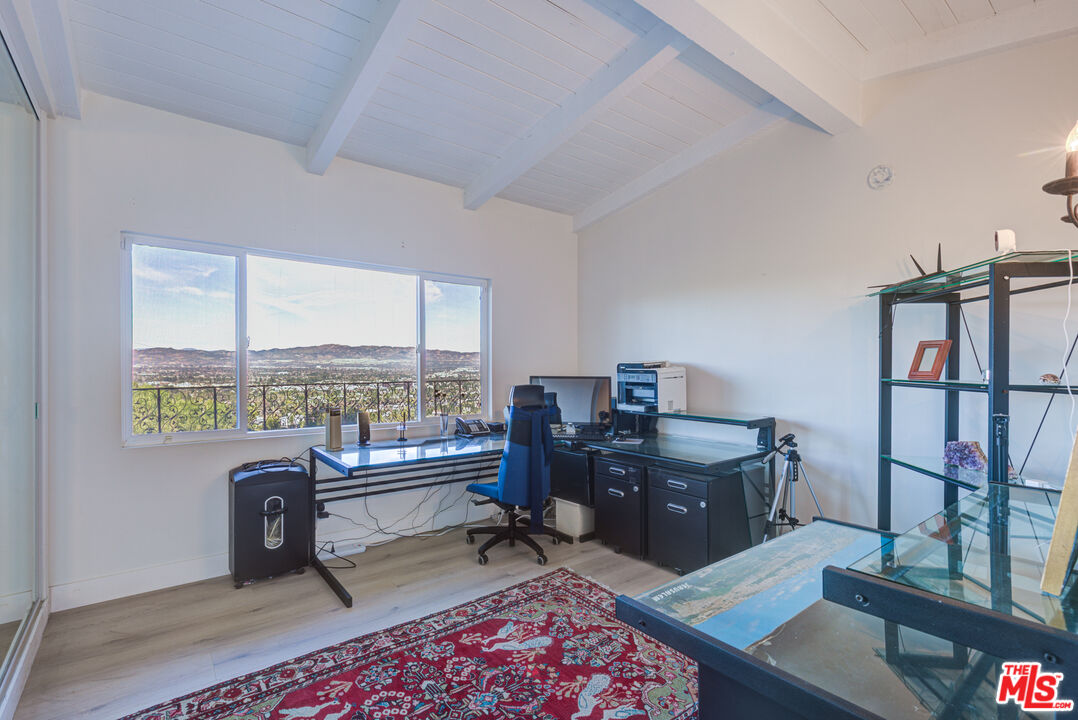4520 Gable Drive Encino, CA 91316 - Photo 50 of 58 a view of a workspace with furniture and a window