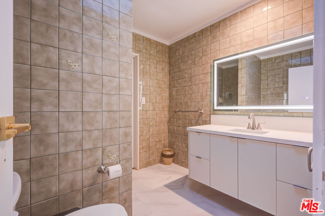 4520 Gable Drive Encino, CA 91316 - Photo 58 of 58 a bathroom with a sink toilet and shower