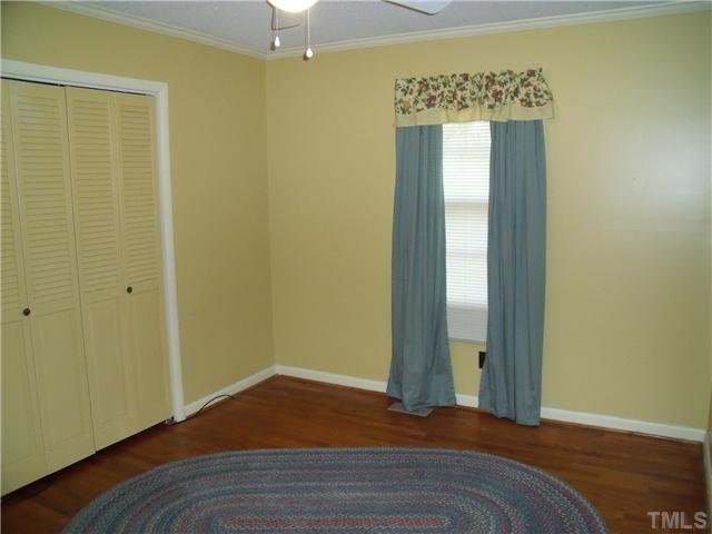 471 Shepard Road Norlina, NC 27563 - Photo 8 of 14 Bedroom 2 has same as all the bedrooms, ceiling fan and HW floors.