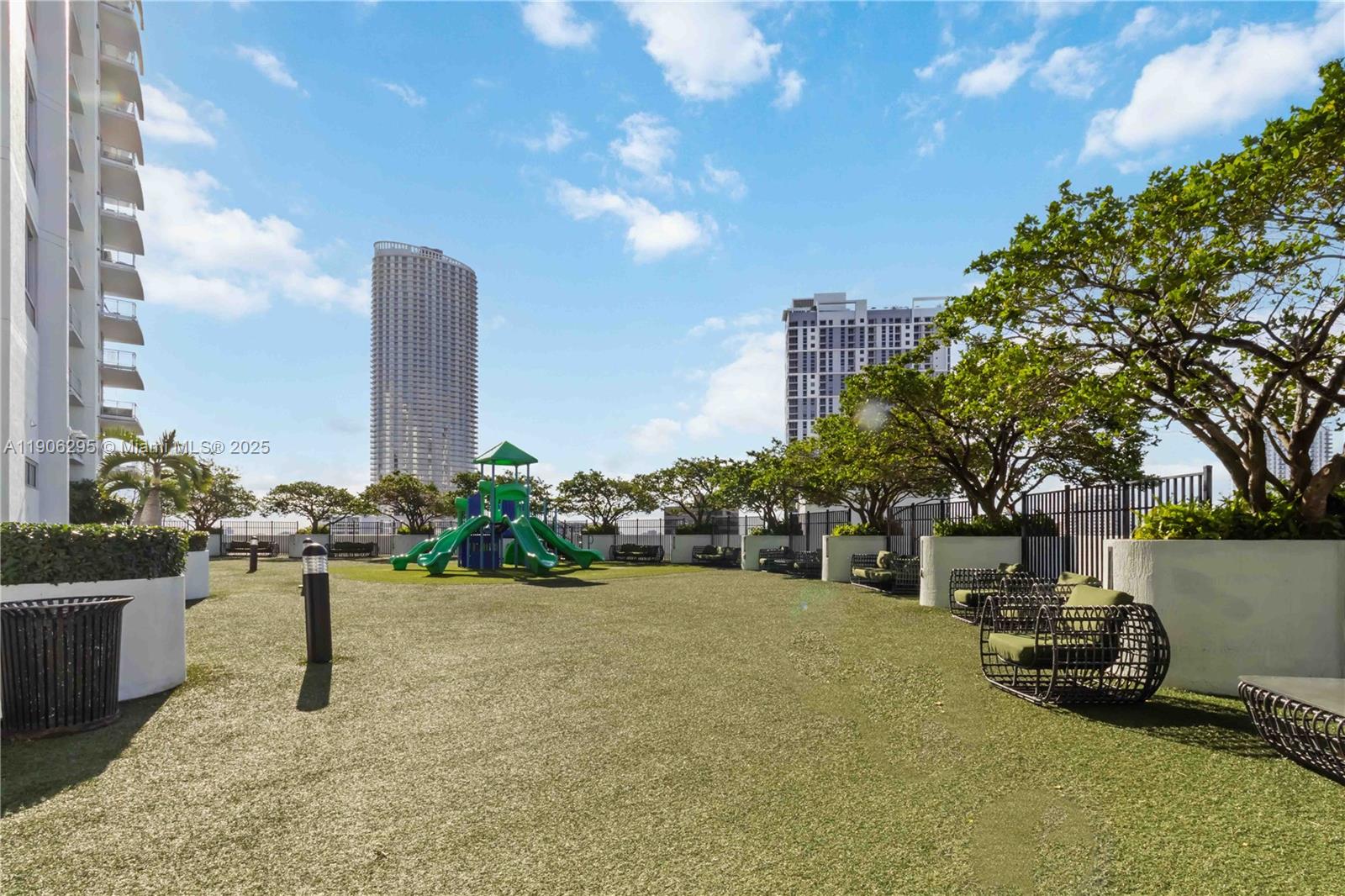 90 Southwest 3rd Street, Unit 4305 Miami, FL 33130 - Photo 16 of 16 a view of a terrace with a bench and trees