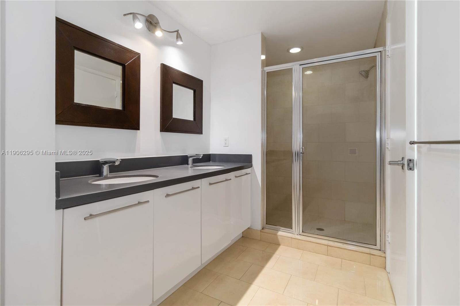 90 Southwest 3rd Street, Unit 4305 Miami, FL 33130 - Photo 8 of 16 a bathroom with a sink and a mirror