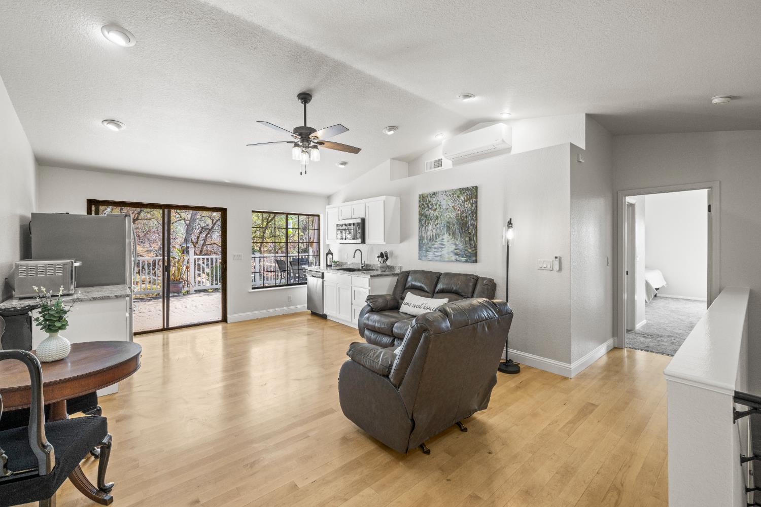 14580 McElroy Road Auburn, CA 95602 - Photo 11 of 48 a living room with furniture and a chandelier