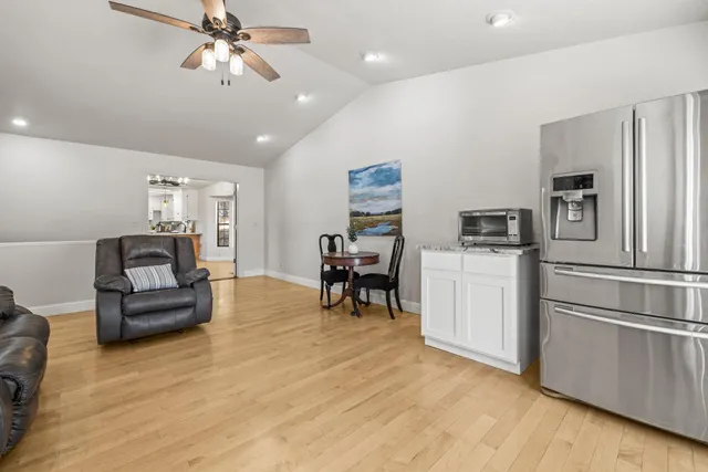 a living room with furniture and a table