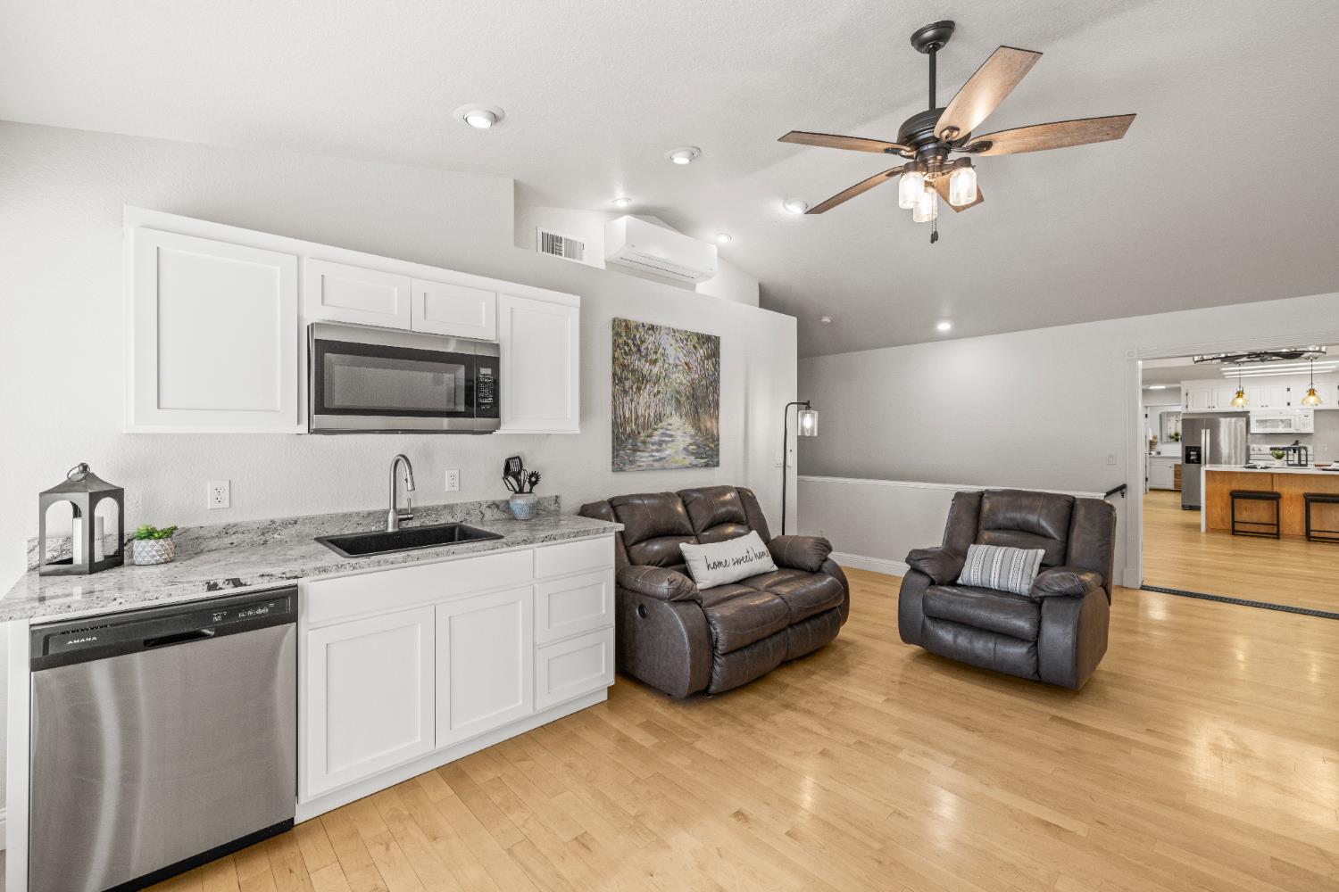 14580 McElroy Road Auburn, CA 95602 - Photo 14 of 48 a living room with furniture kitchen view and a flat screen tv
