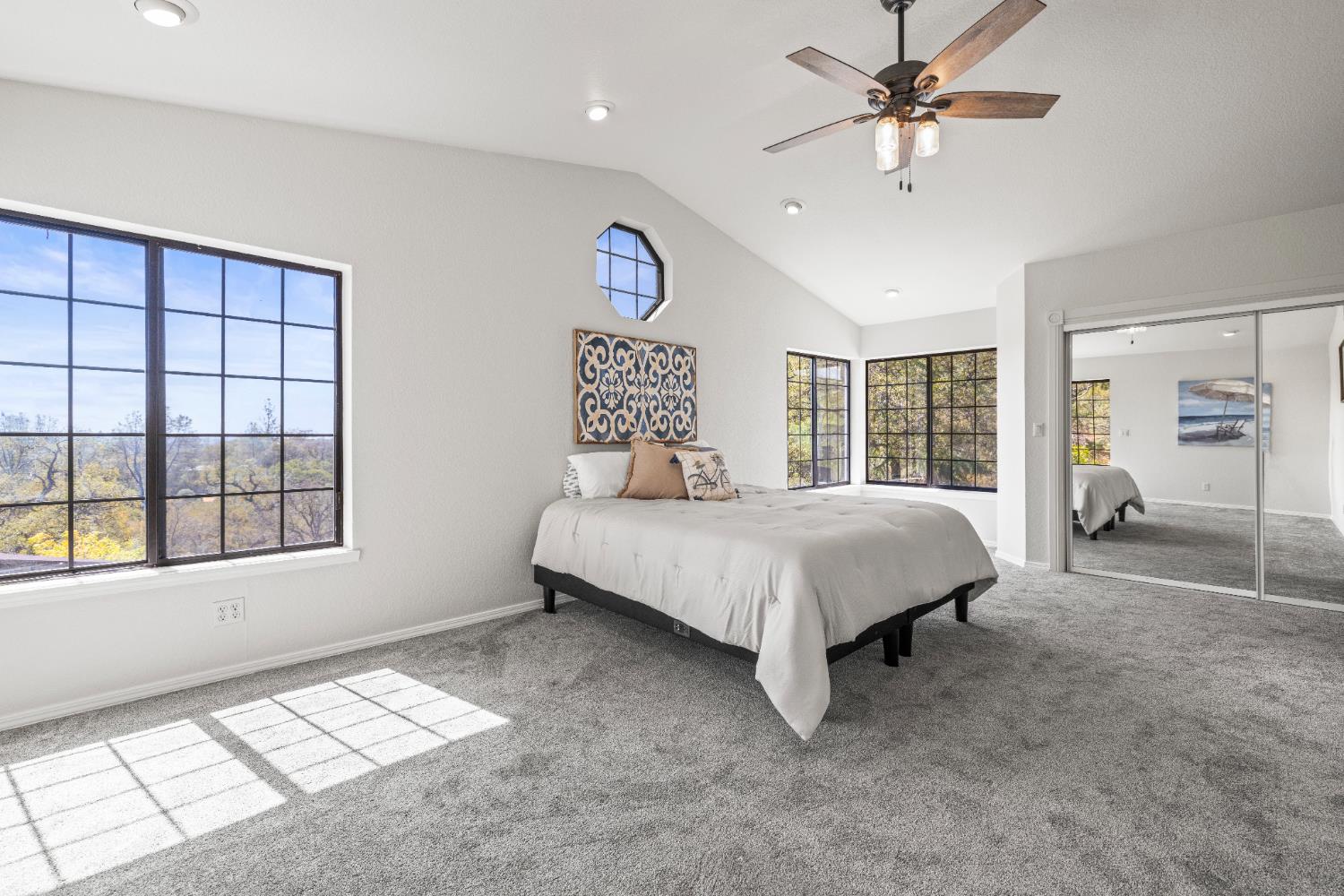 14580 McElroy Road Auburn, CA 95602 - Photo 16 of 48 a spacious bedroom with a large bed and a window