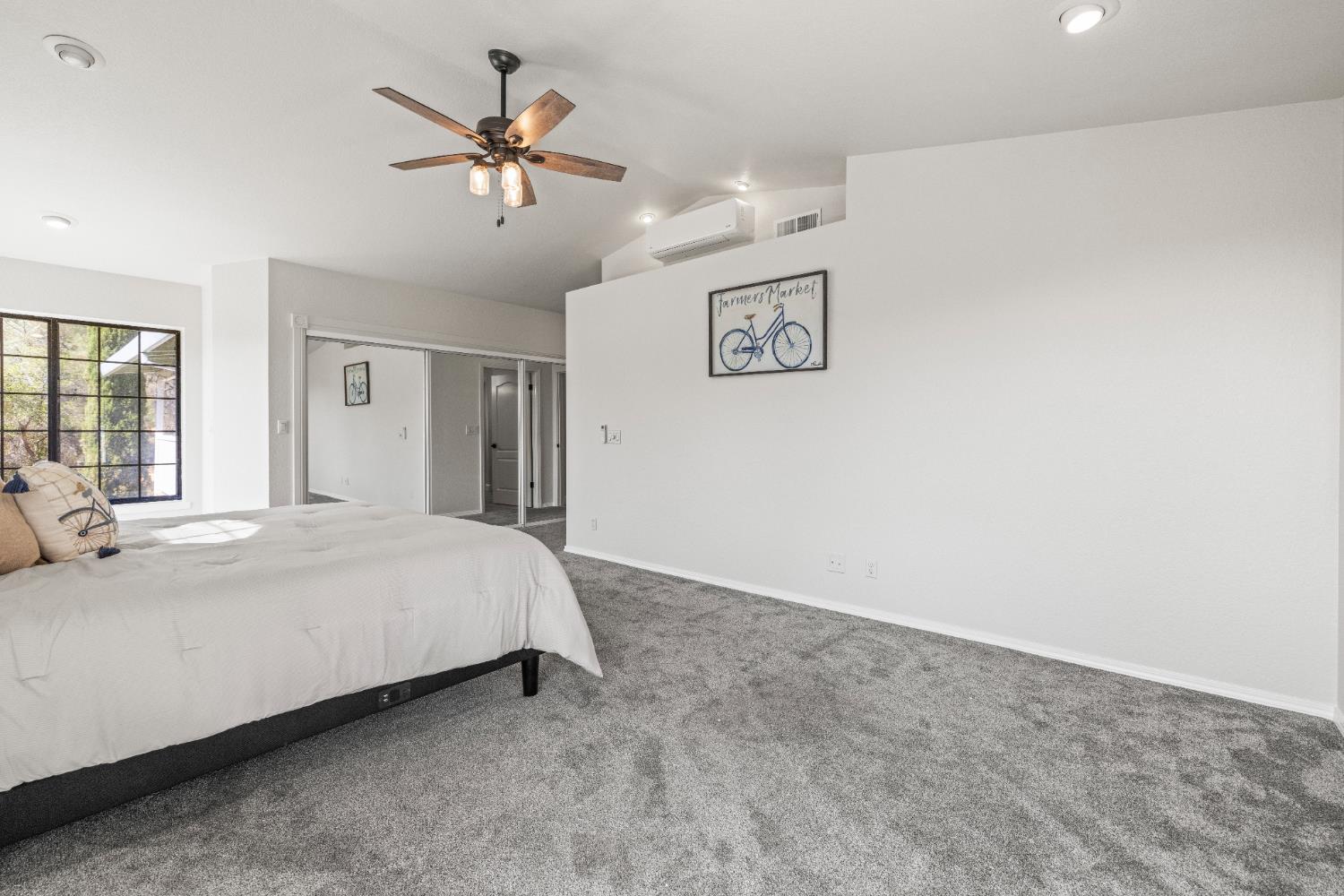 14580 McElroy Road Auburn, CA 95602 - Photo 17 of 48 a bed room with a bed and a ceiling fan