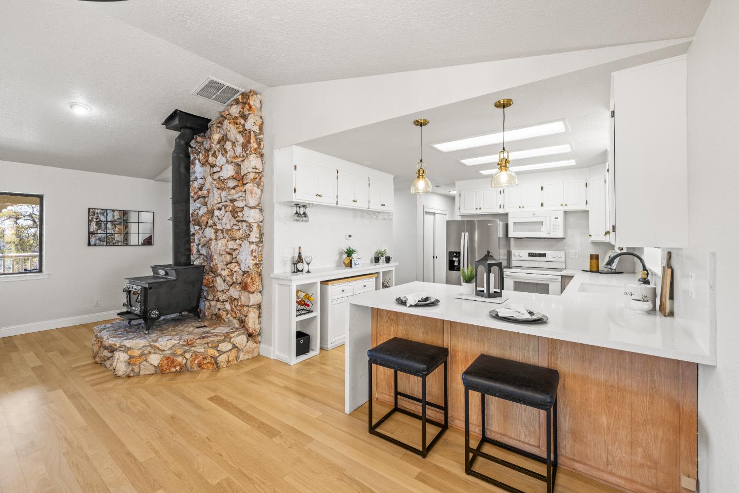 14580 McElroy Road Auburn, CA 95602 - Photo 2 of 48 a kitchen with stainless steel appliances kitchen island granite countertop a sink and cabinets