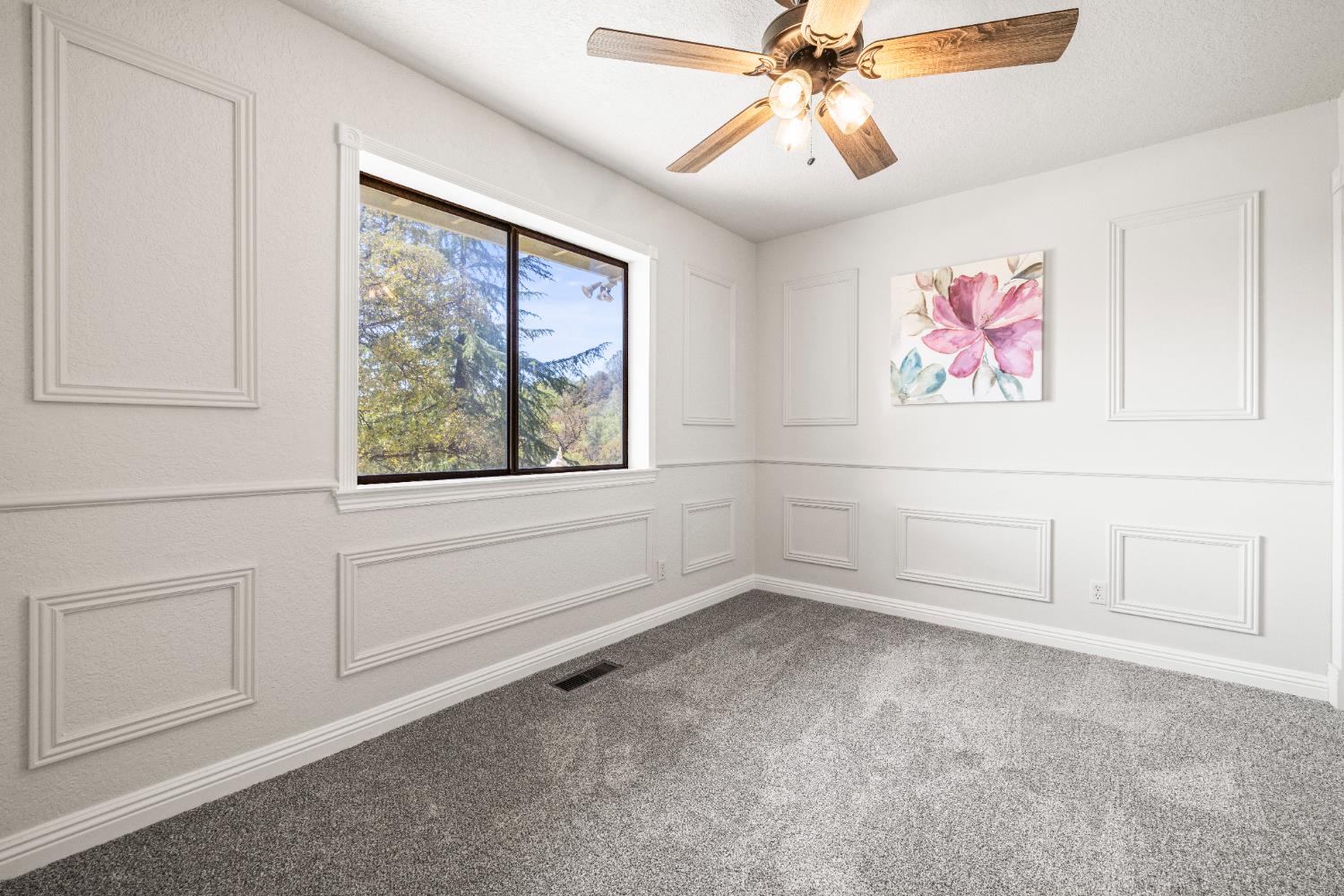 14580 McElroy Road Auburn, CA 95602 - Photo 21 of 48 an empty room with windows and fan