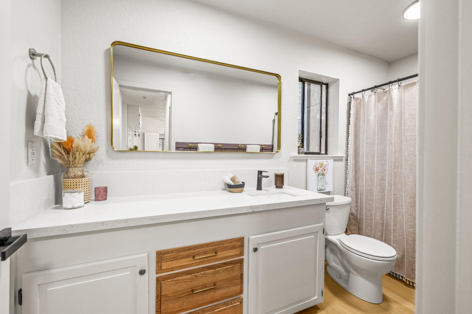 14580 McElroy Road Auburn, CA 95602 - Photo 23 of 48 a bathroom with a toilet sink and mirror